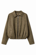 An olive green cropped zip-up jacket with a collar, laid flat against a white background.