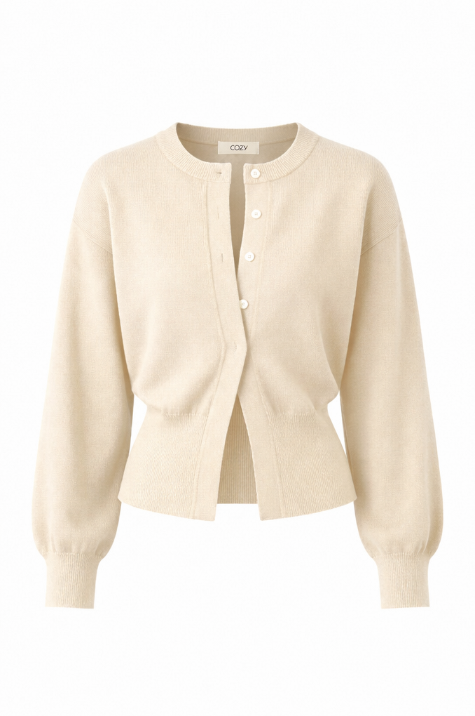 A cream-colored knit cardigan sweater with a button-up front, long balloon sleeves, and a relaxed fit, shown on a plain white background.